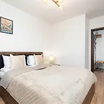 Family In Center With Air Conditioning And View By Renters Apartment